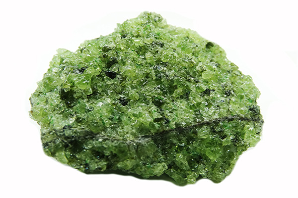 Figure 2b: A picture of olivine (the green crystals), an example of a silicate structure composed of isolated tetrahedrons, with a vein of basalt (the gray material).
