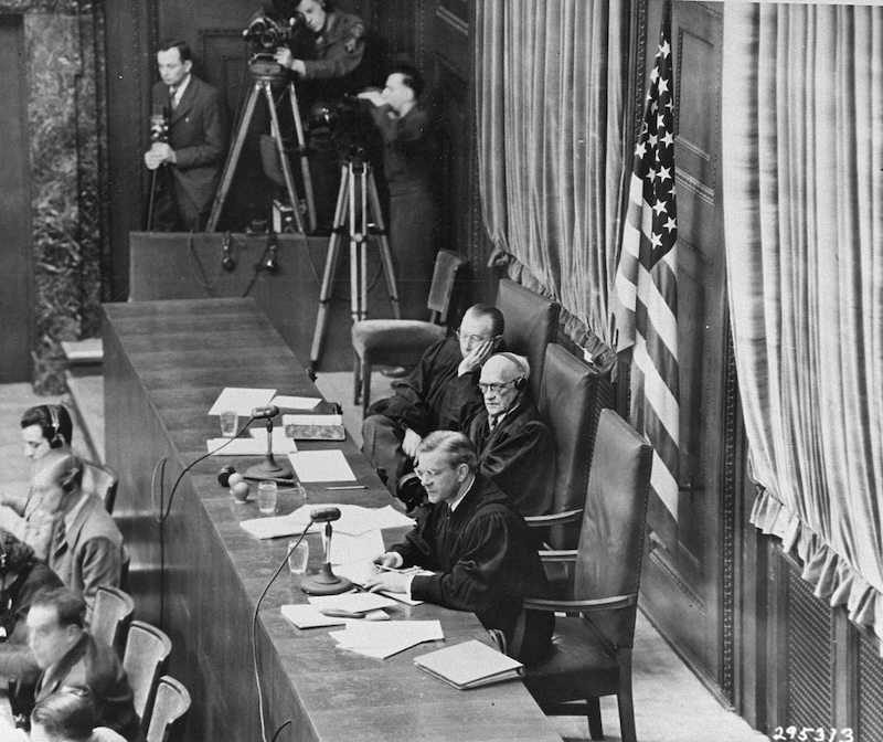 Figure 3: The judges' chamber from the Nuremberg Trials.
