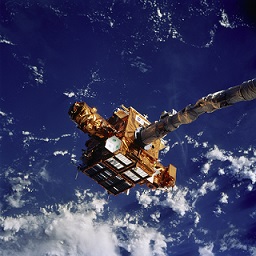 Figure 4: The SPARTAN spacecraft held in the grasp of the space shuttle's robotic arm during STS-87 in 1997.