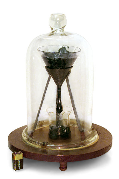 Figure 10: The Pitch Drop Experiment at the University of Queensland (battery shown for size comparison).
