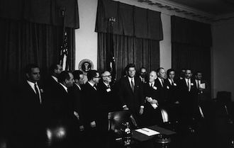 Figure 1: President John F. Kennedy meets with scientific representatives of American countries, including Dr. Bernardo Houssay.