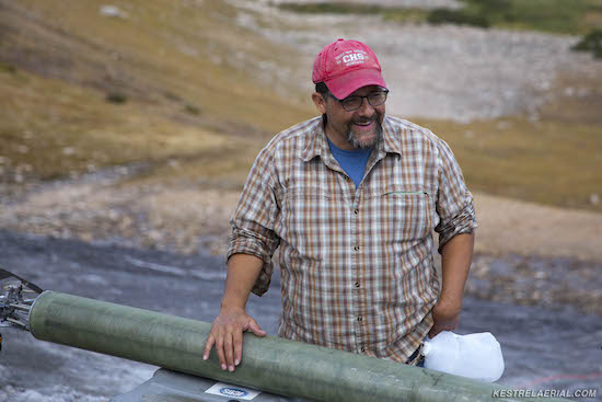 Figure 8: Craig Lee in the field with the inner barrel of a two-barrel ice coring system known as the Prairie Dog, designed by Jay Kyne and Joe McConnell of the Ice Drilling Design and Operations (IDDO) program based at the University of Wisconsin, Madison.