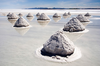 Figure 5: A traditional way of making salt is to harvest it by allowing the water to evaporate, like these mounds in Salar de Uyuni, Bolivia.