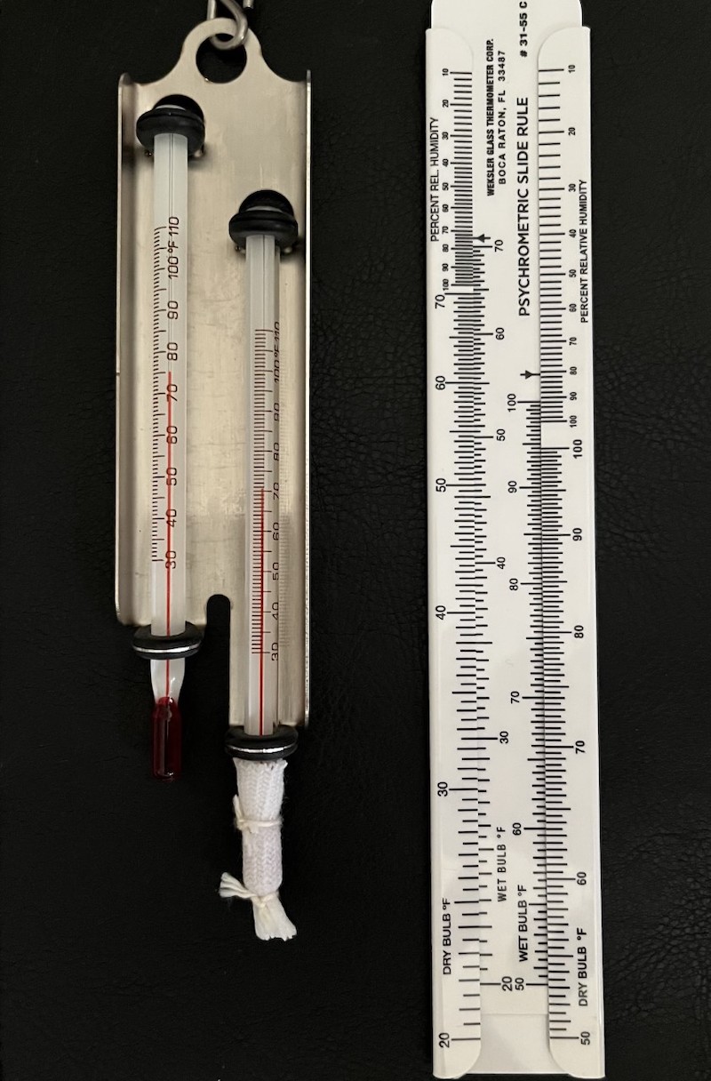 Figure 5: A wet-dry bulb hygrometer with a table. 