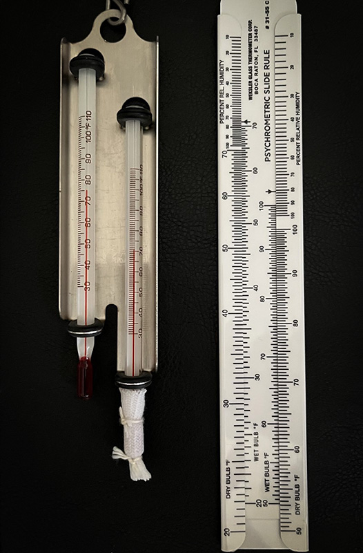 Figure 5: A wet-dry bulb hygrometer with a table. 